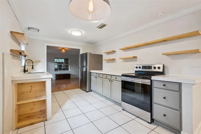 a kitchen with stainless steel appliances and cabinets