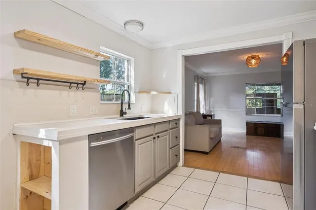 a kitchen with a sink and cabinets