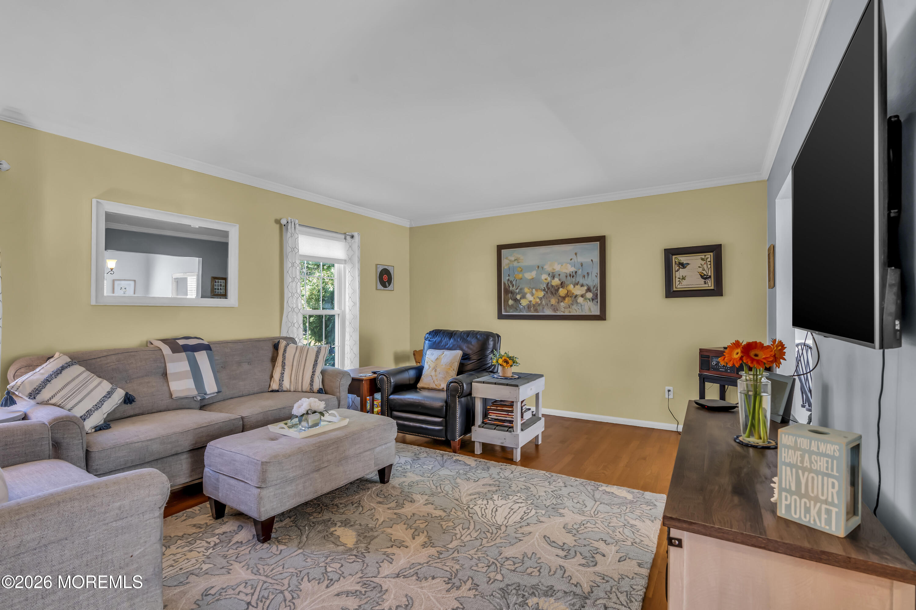 18 Claire Circle Howell, NJ 07731 - Photo 11 of 41 a living room with furniture and a flat screen tv