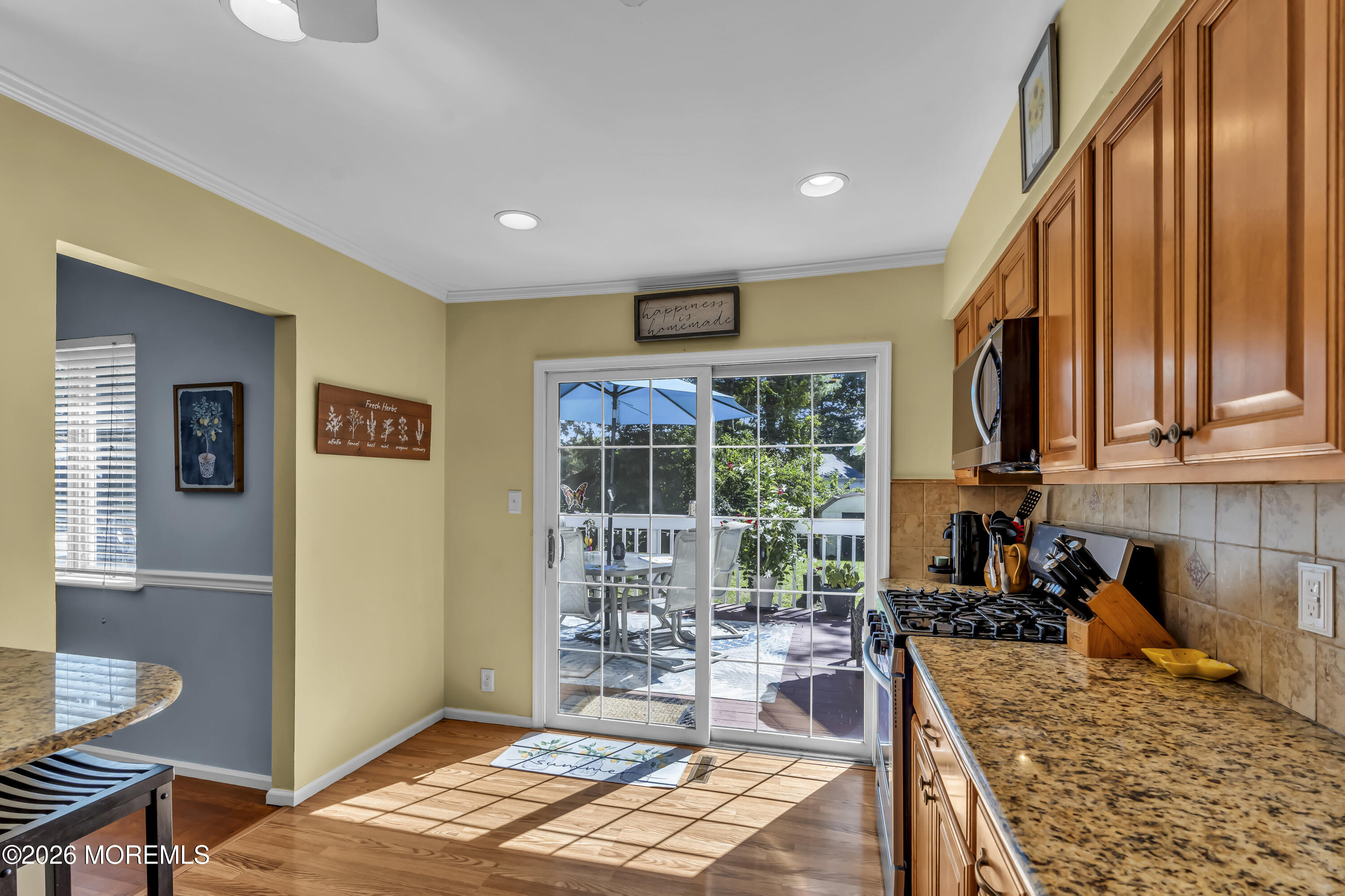 18 Claire Circle Howell, NJ 07731 - Photo 16 of 41 a kitchen with sink refrigerator and dining table