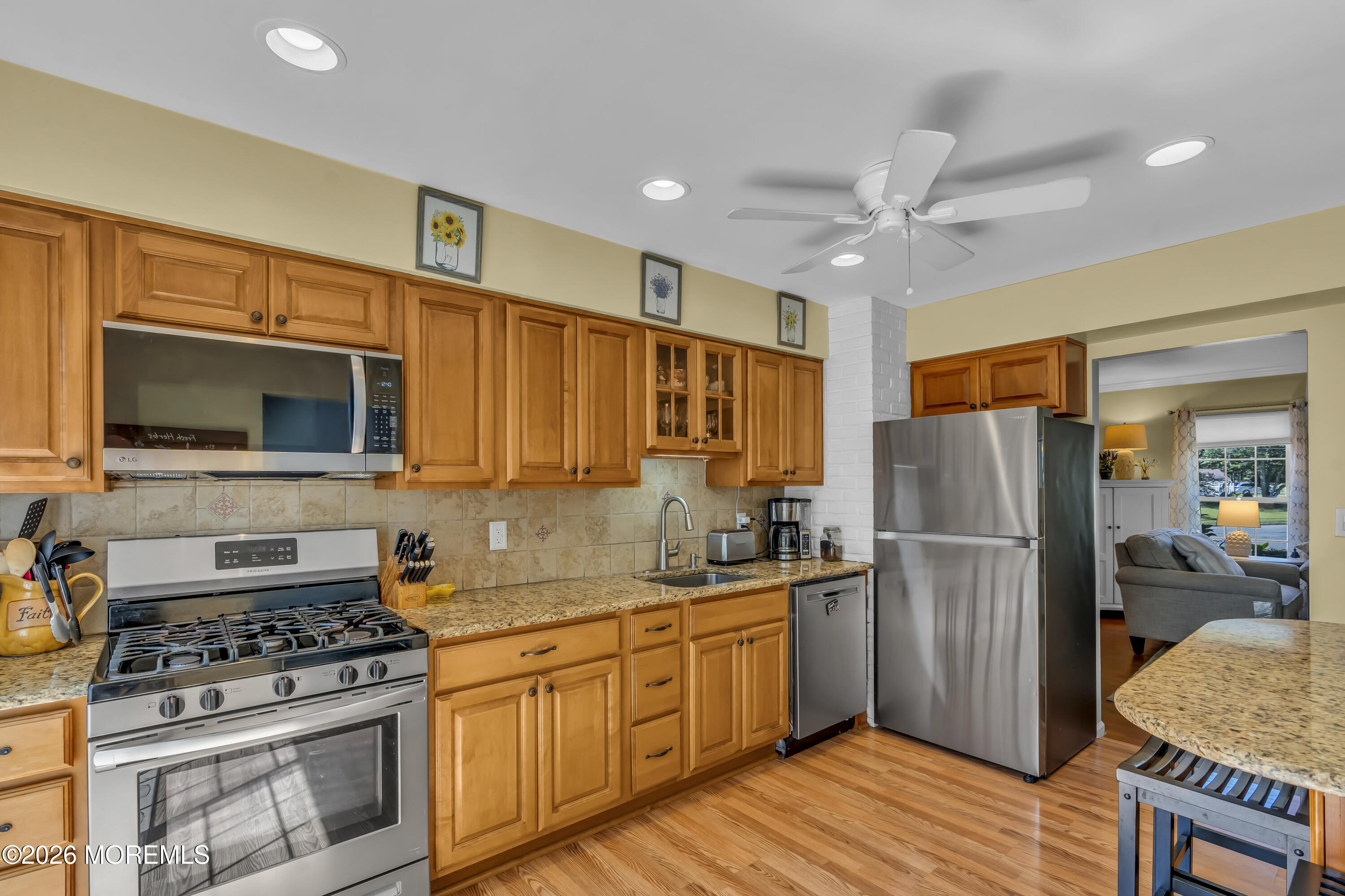 18 Claire Circle Howell, NJ 07731 - Photo 17 of 41 a kitchen with stainless steel appliances granite countertop a refrigerator stove and sink