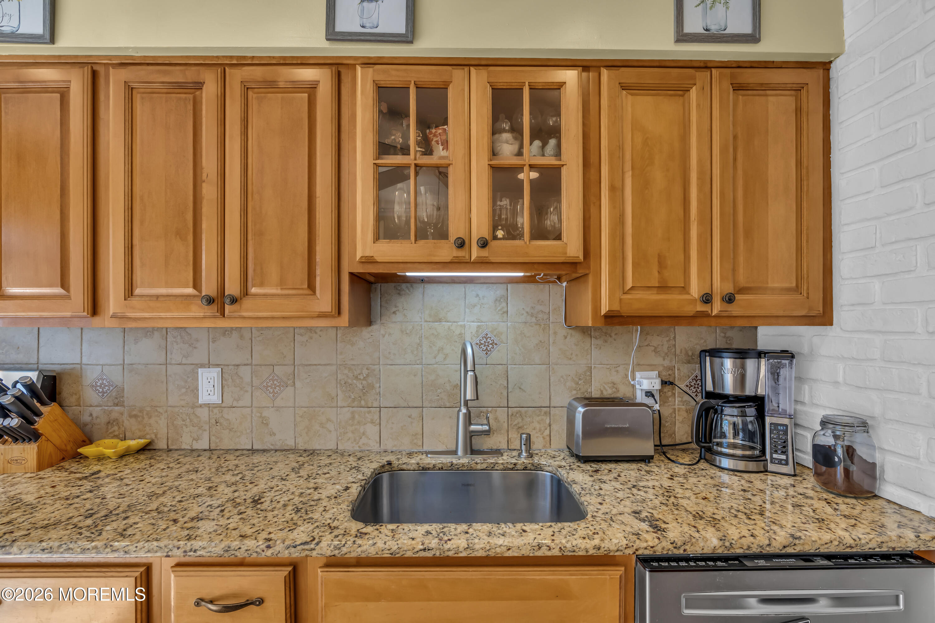 18 Claire Circle Howell, NJ 07731 - Photo 19 of 41 a kitchen with granite countertop stainless steel appliances granite countertop a sink and cabinets
