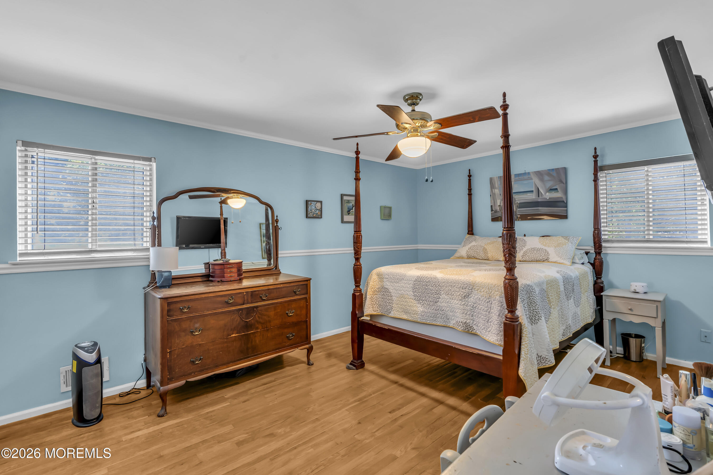 18 Claire Circle Howell, NJ 07731 - Photo 24 of 41 a bedroom with a bed and a chandelier