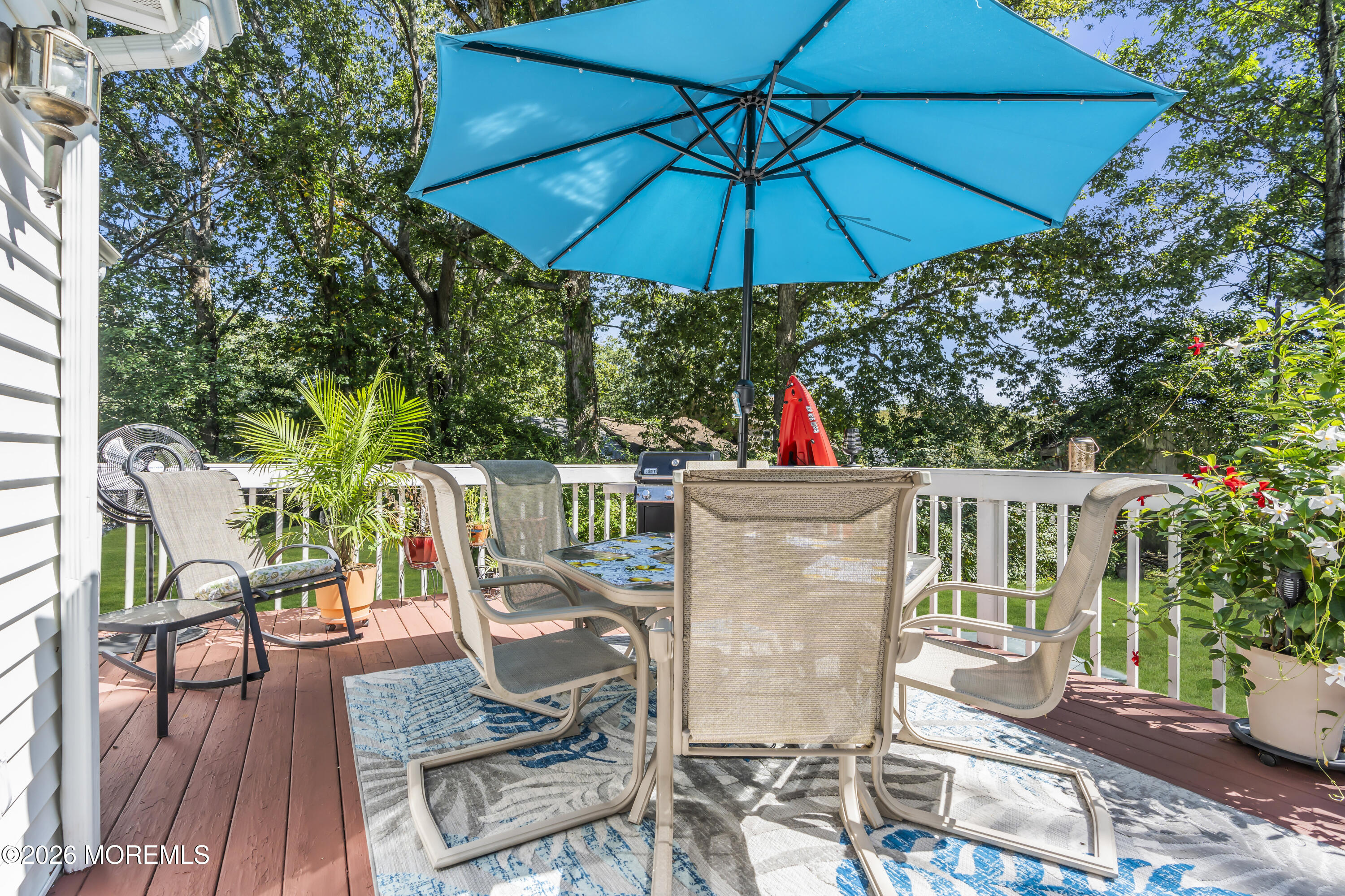 18 Claire Circle Howell, NJ 07731 - Photo 30 of 41 a view of balcony with outdoor seating and wooden floor