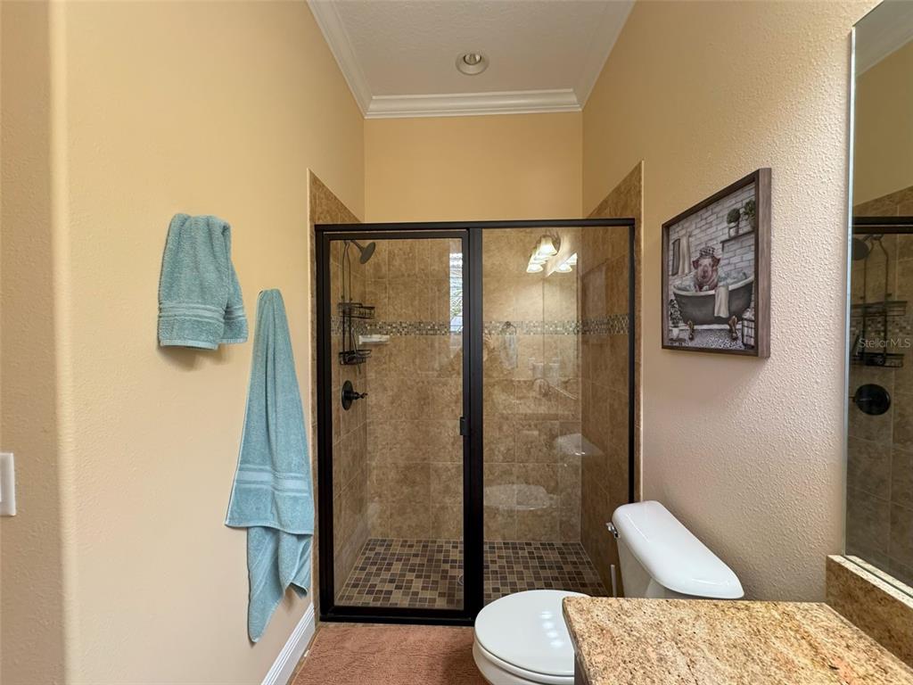 1024 West Beagle Run Loop Hernando, FL 34442 - Photo 24 of 44 a bathroom with a toilet sink and shower