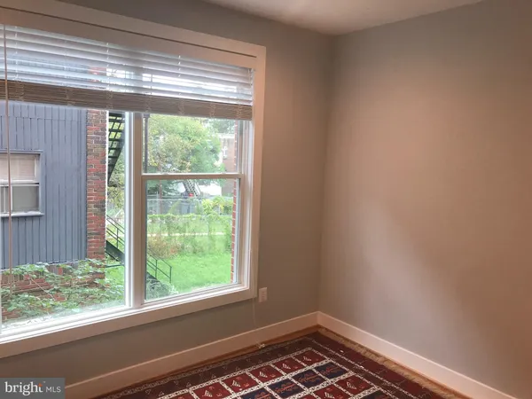 a view of a room that has a window