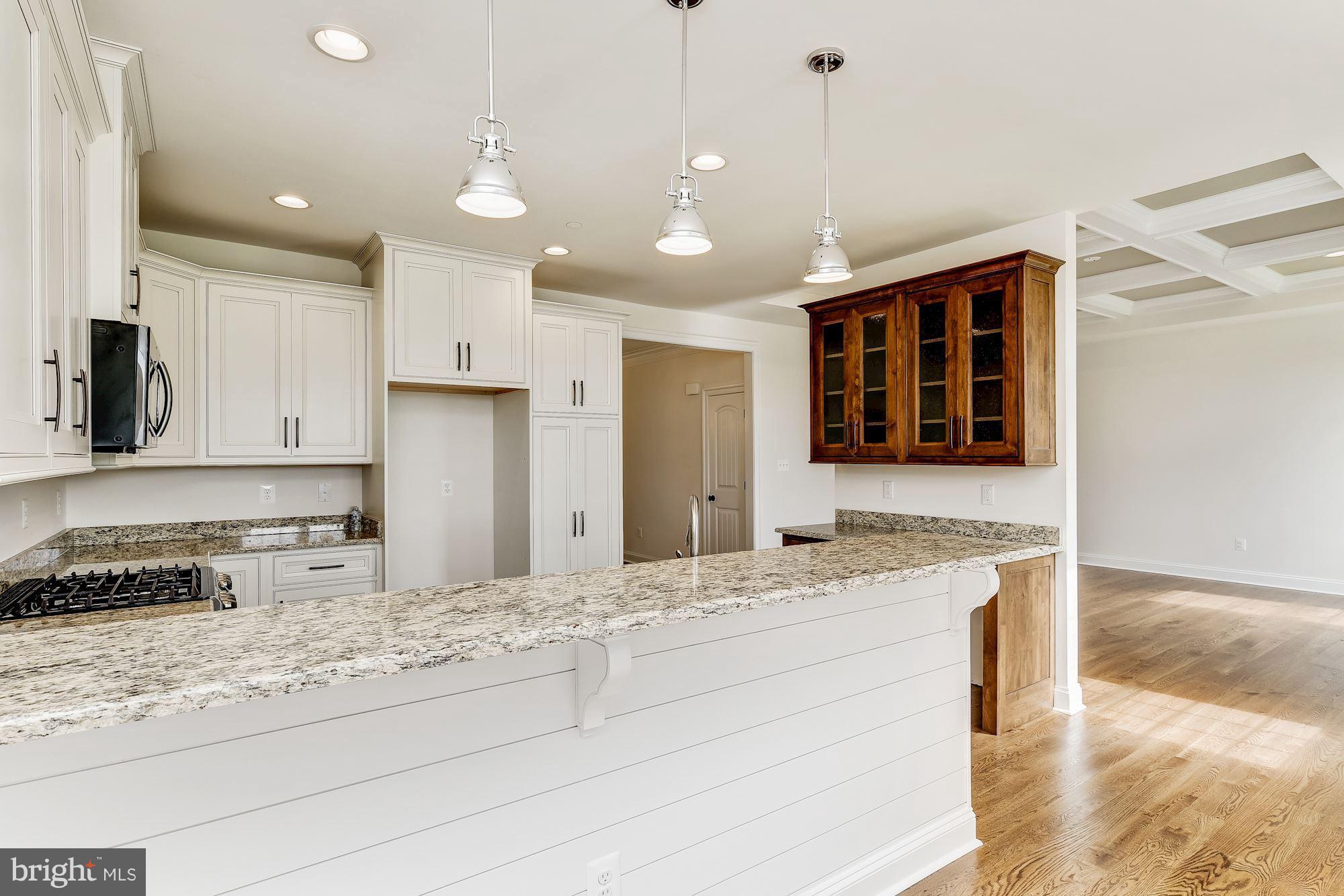 3664 Hooper Road New Windsor, MD 21776 - Photo 5 of 30 a kitchen with stainless steel appliances granite countertop sink stove and refrigerator