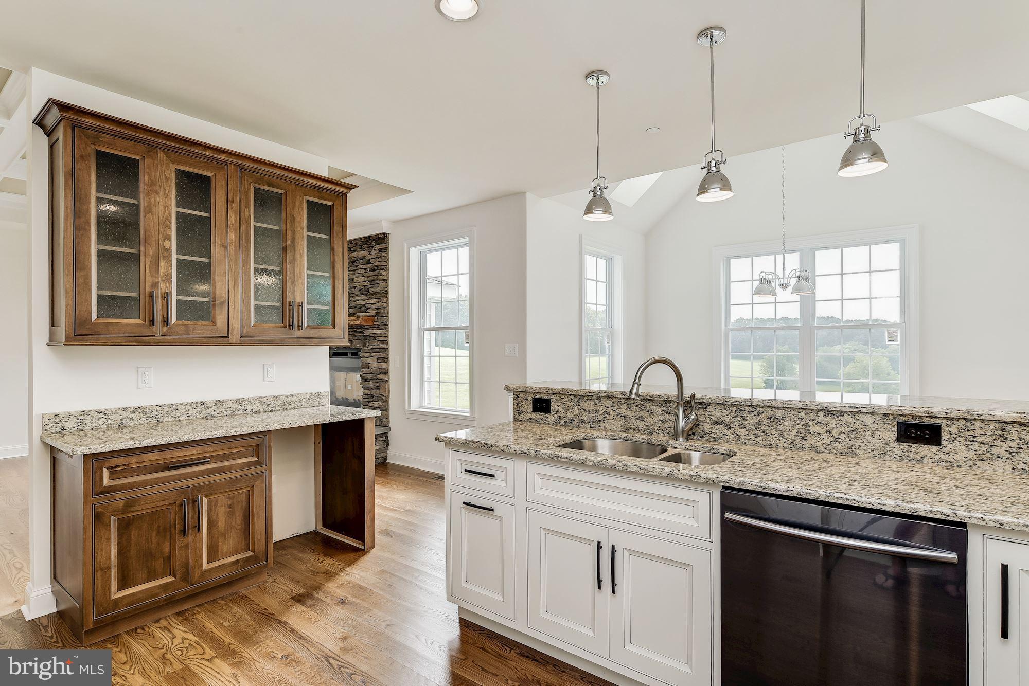 3664 Hooper Road New Windsor, MD 21776 - Photo 6 of 30 a kitchen with a sink stove and cabinets