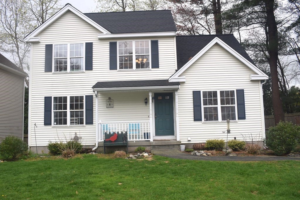 68 Meadowood Road North Andover, MA 01845 - Photo 1 of 40 a front view of a house with a yard and garage
