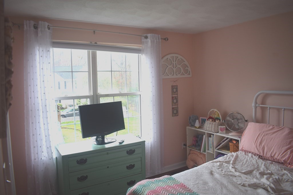 68 Meadowood Road North Andover, MA 01845 - Photo 24 of 40 a bedroom with a bed and a desk