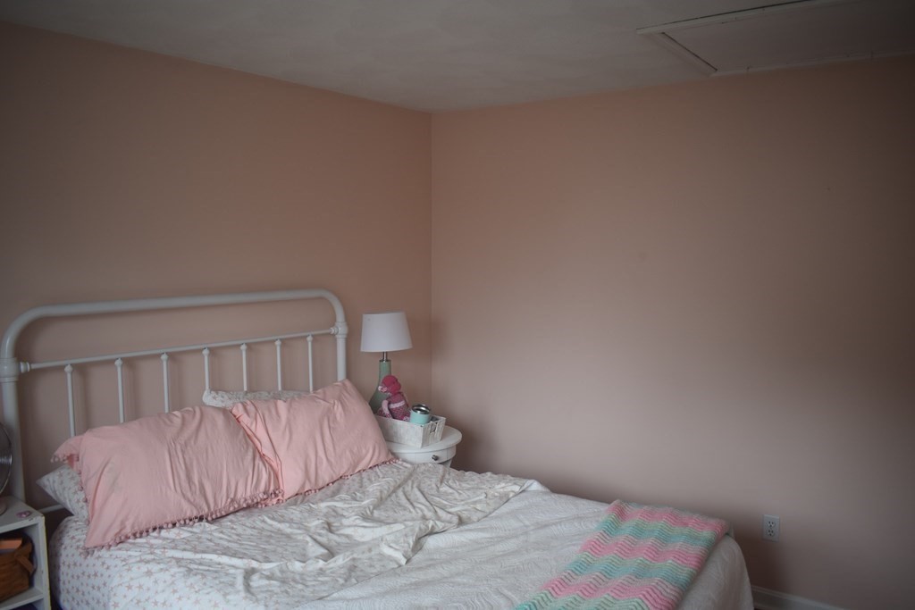 68 Meadowood Road North Andover, MA 01845 - Photo 27 of 40 a bedroom with a bed and a mirror