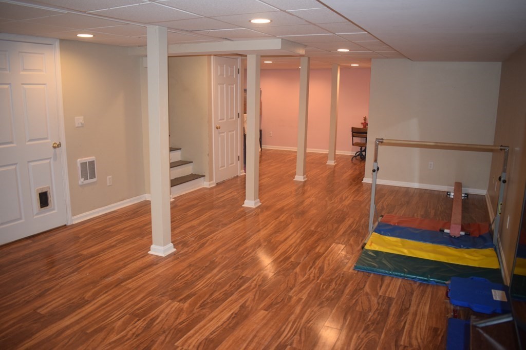 68 Meadowood Road North Andover, MA 01845 - Photo 31 of 40 a living room with wooden floor and a table