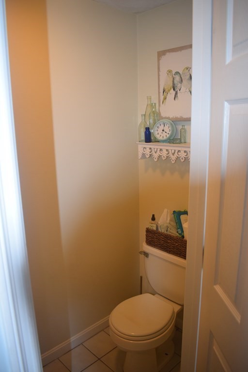 68 Meadowood Road North Andover, MA 01845 - Photo 33 of 40 a white toilet sitting next to a small bathroom