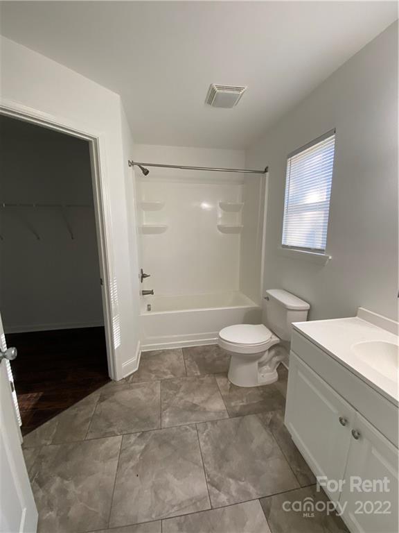 3708 Kelly Road Charlotte, NC 28216 - Photo 11 of 12 a bathroom with a toilet a sink and a shower