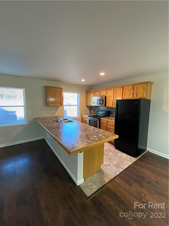 3708 Kelly Road Charlotte, NC 28216 - Photo 4 of 12 a living room with furniture window and wooden floor