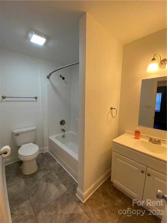 3708 Kelly Road Charlotte, NC 28216 - Photo 8 of 12 a bathroom with a sink a toilet and shower