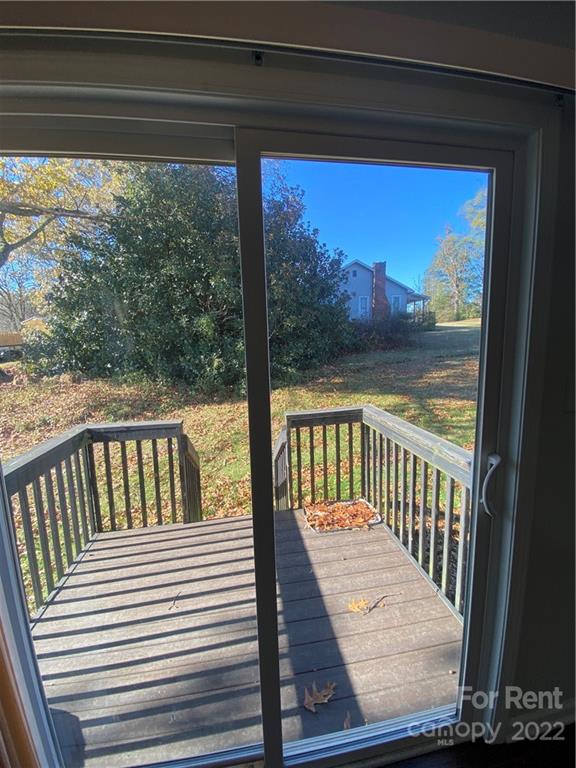 3708 Kelly Road Charlotte, NC 28216 - Photo 10 of 12 a view of a balcony with wooden floor