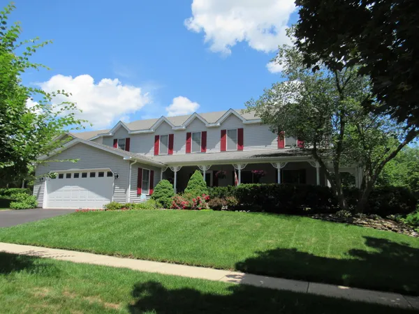 a front view of house with yard and green space