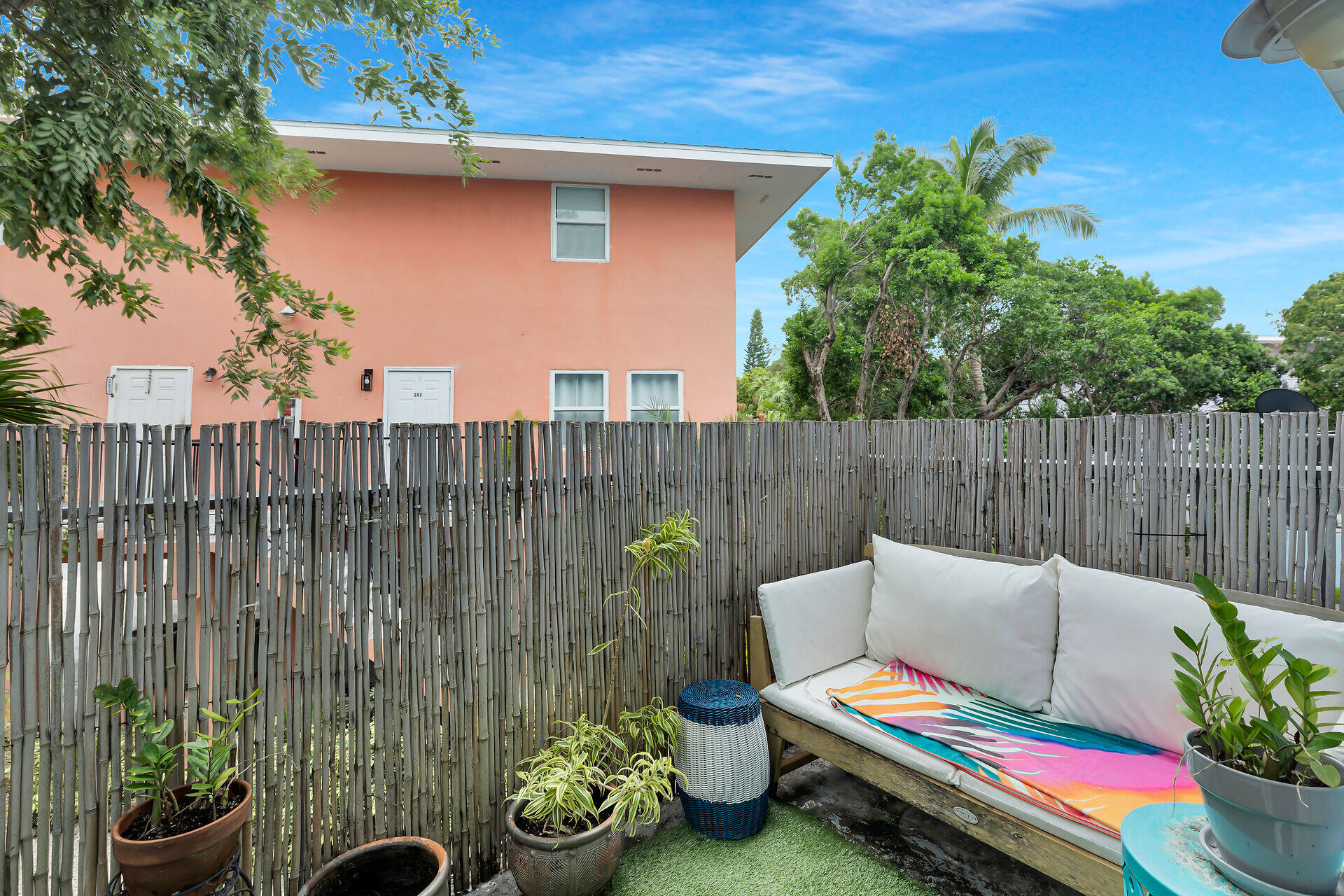 113 Stirrup Key Woods Road, Unit 3B1 Marathon, FL 33050 - Photo 12 of 21 a backyard of a house with table and chairs