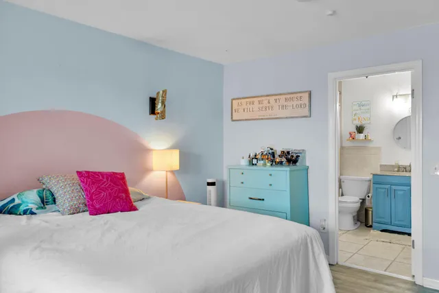 a bedroom with a bed and a dresser