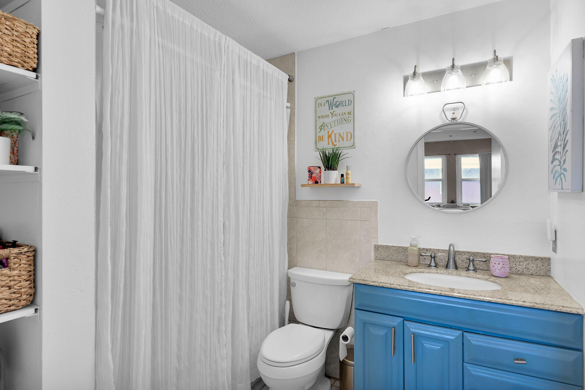113 Stirrup Key Woods Road, Unit 3B1 Marathon, FL 33050 - Photo 16 of 21 a bathroom with a toilet a sink and mirror