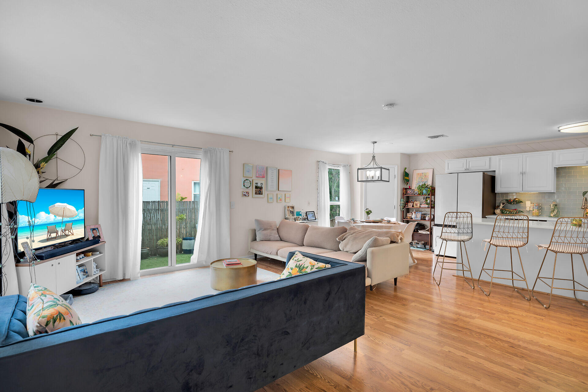 113 Stirrup Key Woods Road, Unit 3B1 Marathon, FL 33050 - Photo 3 of 21 a living room with furniture a flat screen tv and wooden floor