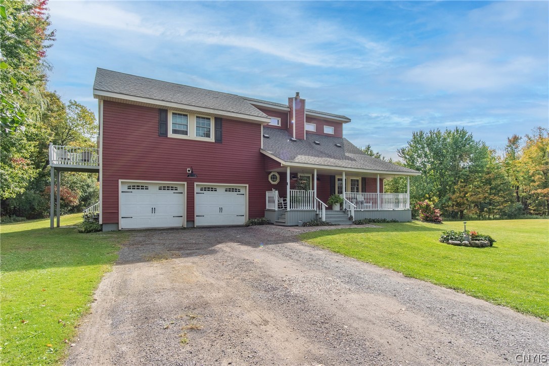 15384 Fuller Road Adams, NY 13606 - Photo 3 of 50 A welcoming front porch and a spacious two-car garage define this charming country home.