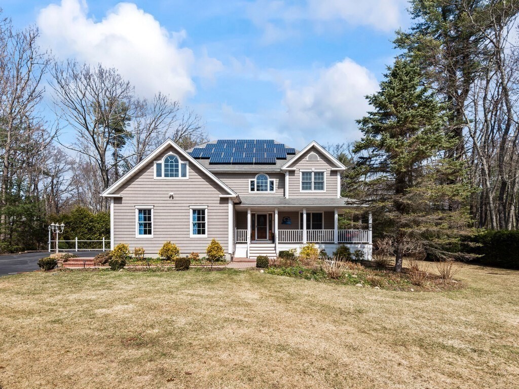9 Santom Street Auburn, MA 01501 - Photo 2 of 42 a front view of a house with a yard