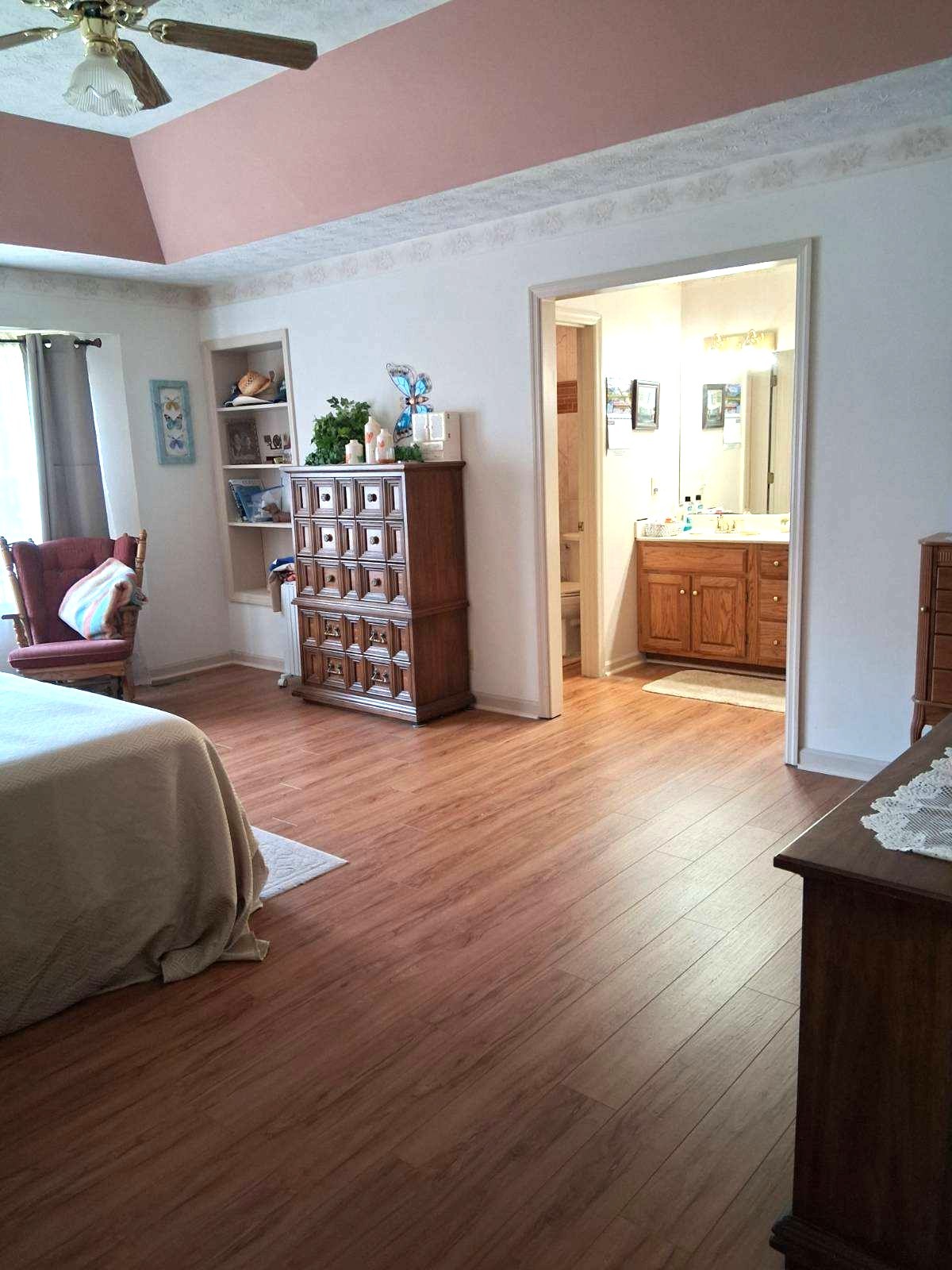3168 Maxey Road Cedar Hill, TN 37032 - Photo 34 of 40 a bedroom with wooden floor and a bed