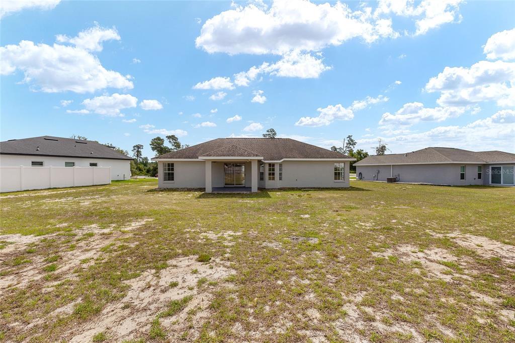 15434 Southwest 23rd Court Road Ocala, FL 34473 - Photo 40 of 41 a front view of house with garden
