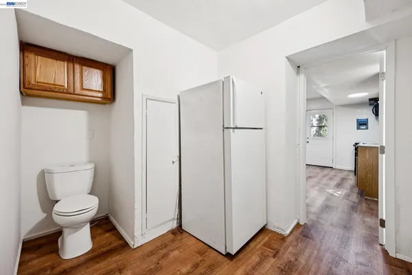 a bathroom with a toilet and a walk in closet