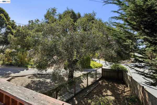 a view of a backyard with sitting area