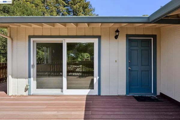 a view of a door of the house and wooden floor