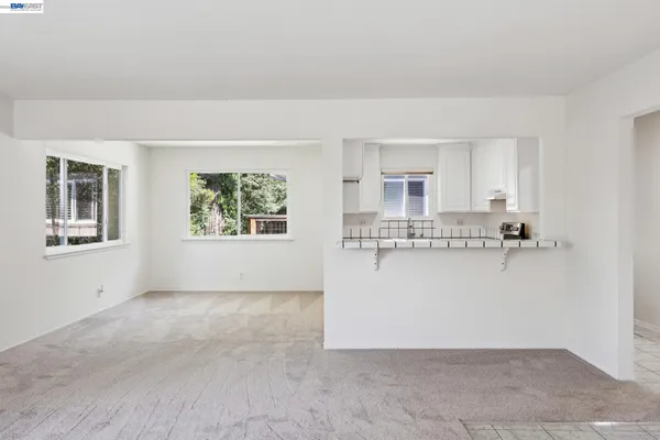 a view of a kitchen with large window