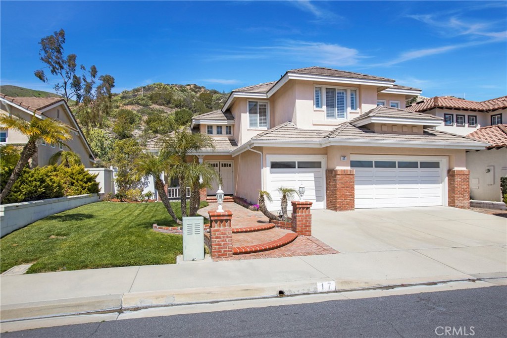 17 Calle Cabrillo Lake Forest, CA 92610 - Photo 1 of 44 front view of a house with a yard