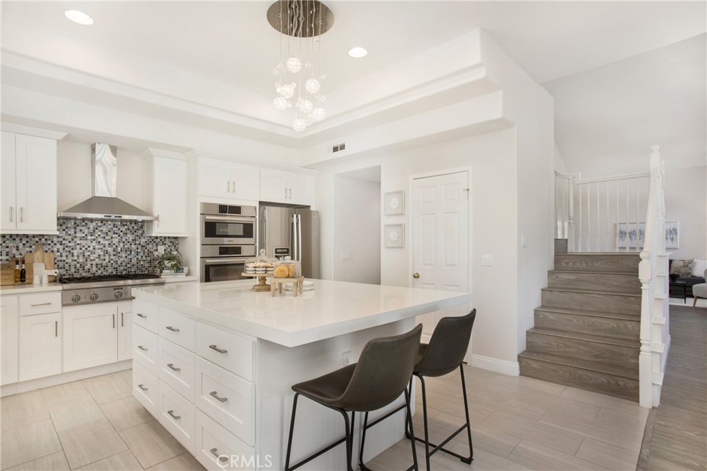17 Calle Cabrillo Lake Forest, CA 92610 - Photo 13 of 44 a kitchen with stainless steel appliances kitchen island granite countertop a sink and cabinets