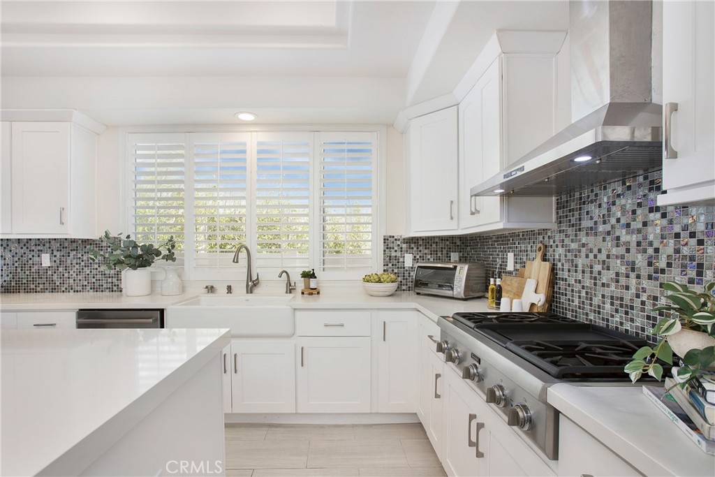 17 Calle Cabrillo Lake Forest, CA 92610 - Photo 16 of 44 a kitchen with a sink stove and cabinets