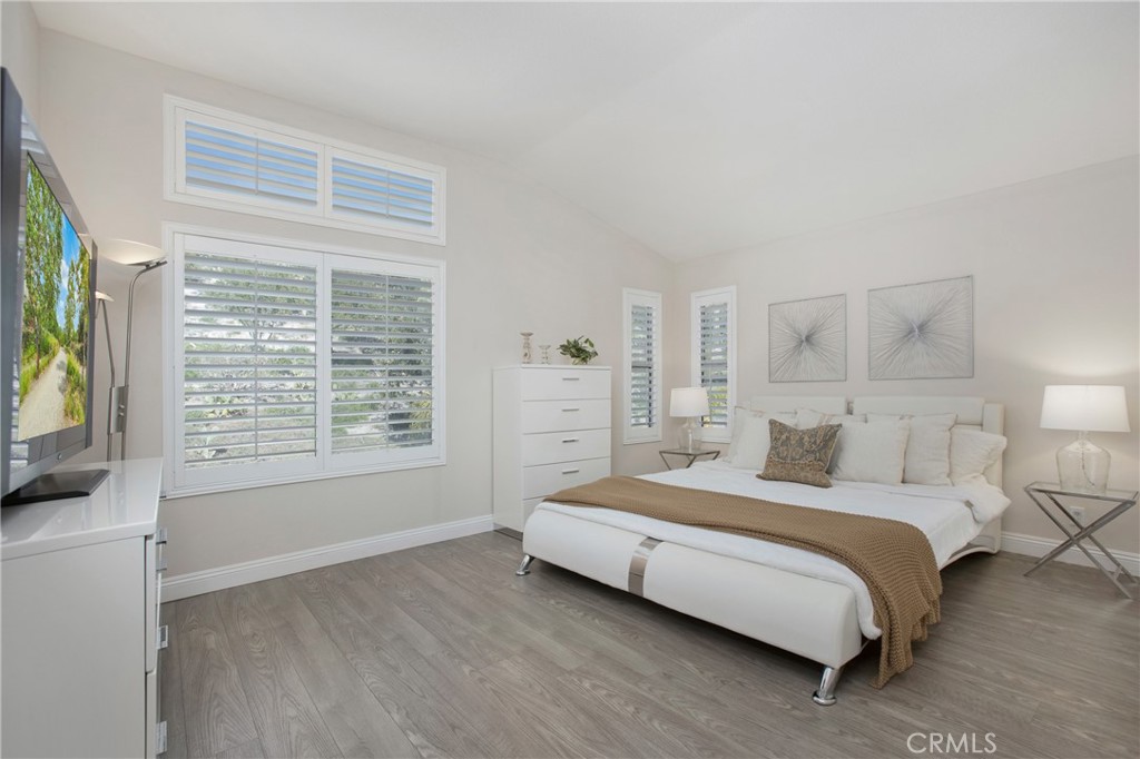 17 Calle Cabrillo Lake Forest, CA 92610 - Photo 21 of 44 a bedroom with a bed and a flat tv screen on dresser