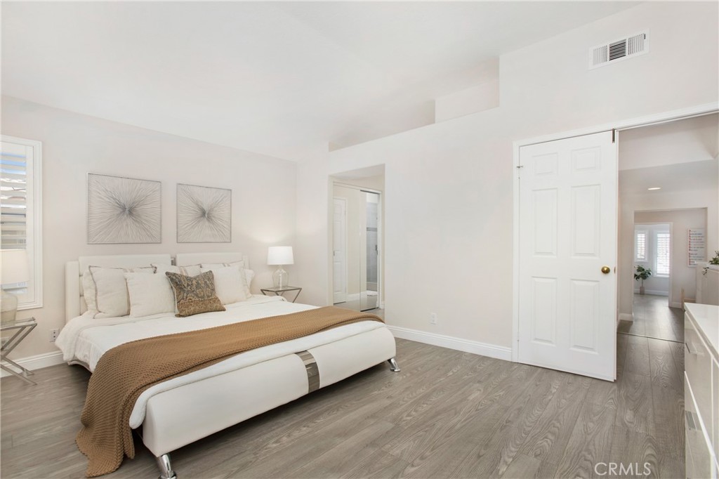 17 Calle Cabrillo Lake Forest, CA 92610 - Photo 22 of 44 a bedroom with a bed and a night lamp