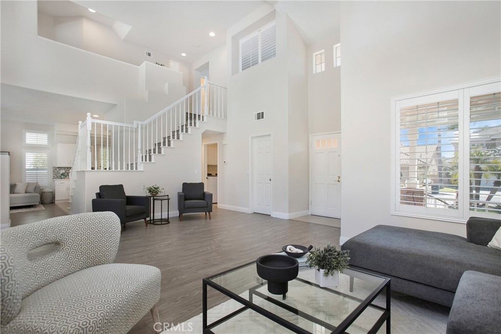 17 Calle Cabrillo Lake Forest, CA 92610 - Photo 7 of 44 a living room with furniture and a large window