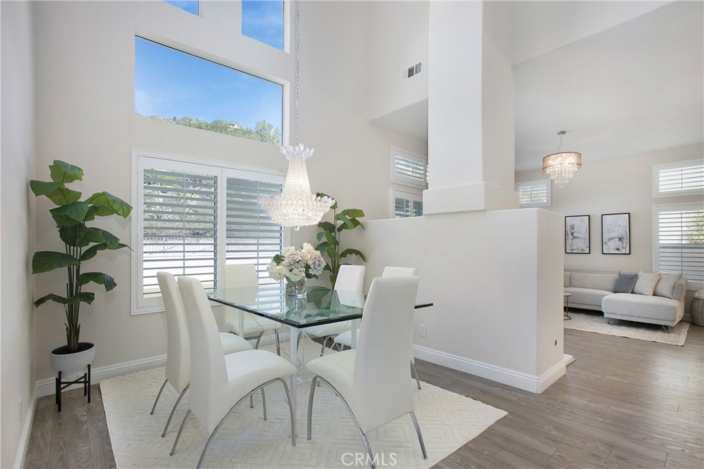 17 Calle Cabrillo Lake Forest, CA 92610 - Photo 8 of 44 a view of a dining room with furniture and wooden floor