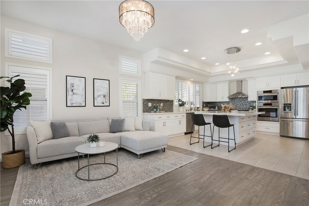 17 Calle Cabrillo Lake Forest, CA 92610 - Photo 10 of 44 a living room with furniture kitchen view and a dining table