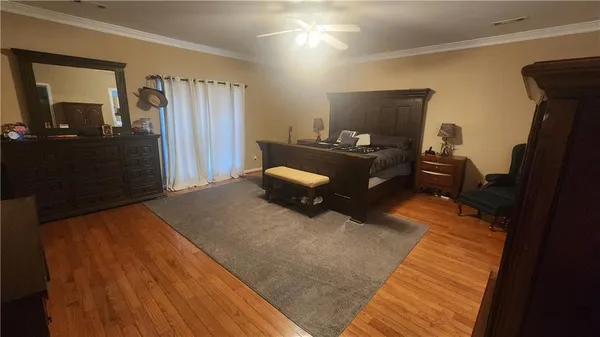 a bedroom with a bed and a mirror