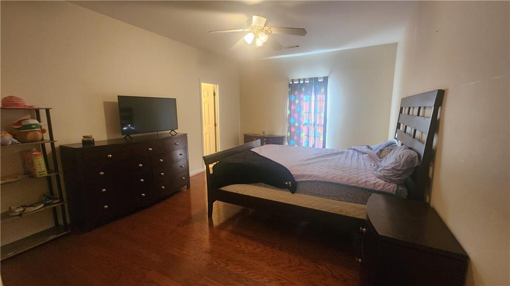 1 North Kenora Drive Southwest Rome, GA 30165 - Photo 12 of 24 a bedroom with a bed and a flat tv screen on dresser