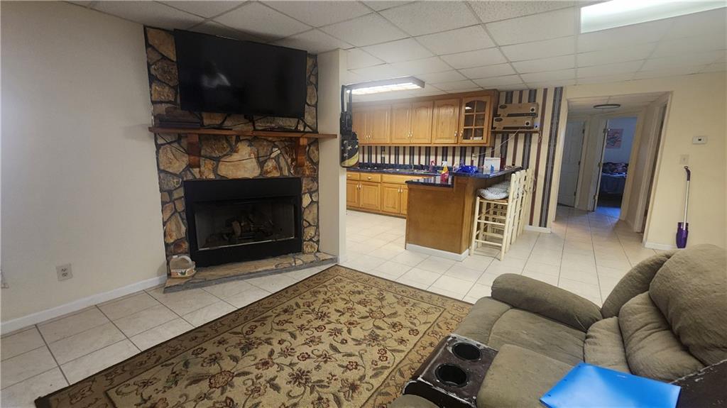 1 North Kenora Drive Southwest Rome, GA 30165 - Photo 13 of 24 a living room with furniture a flat screen tv and a fireplace