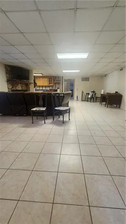 a lobby with furniture and a rug