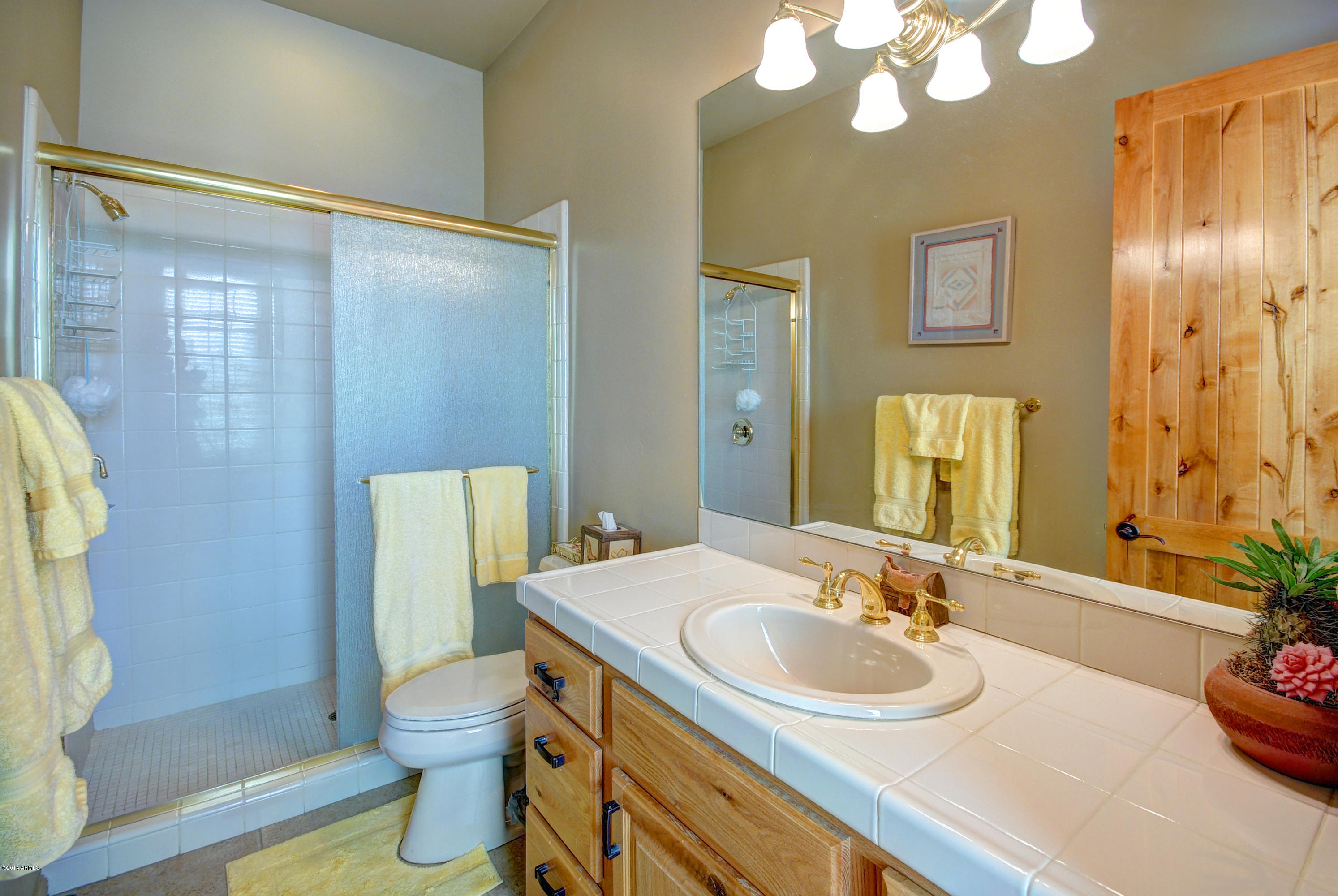 13502 East Jomax Road Scottsdale, AZ 85262 - Photo 23 of 50 a bathroom with a granite countertop sink toilet and shower