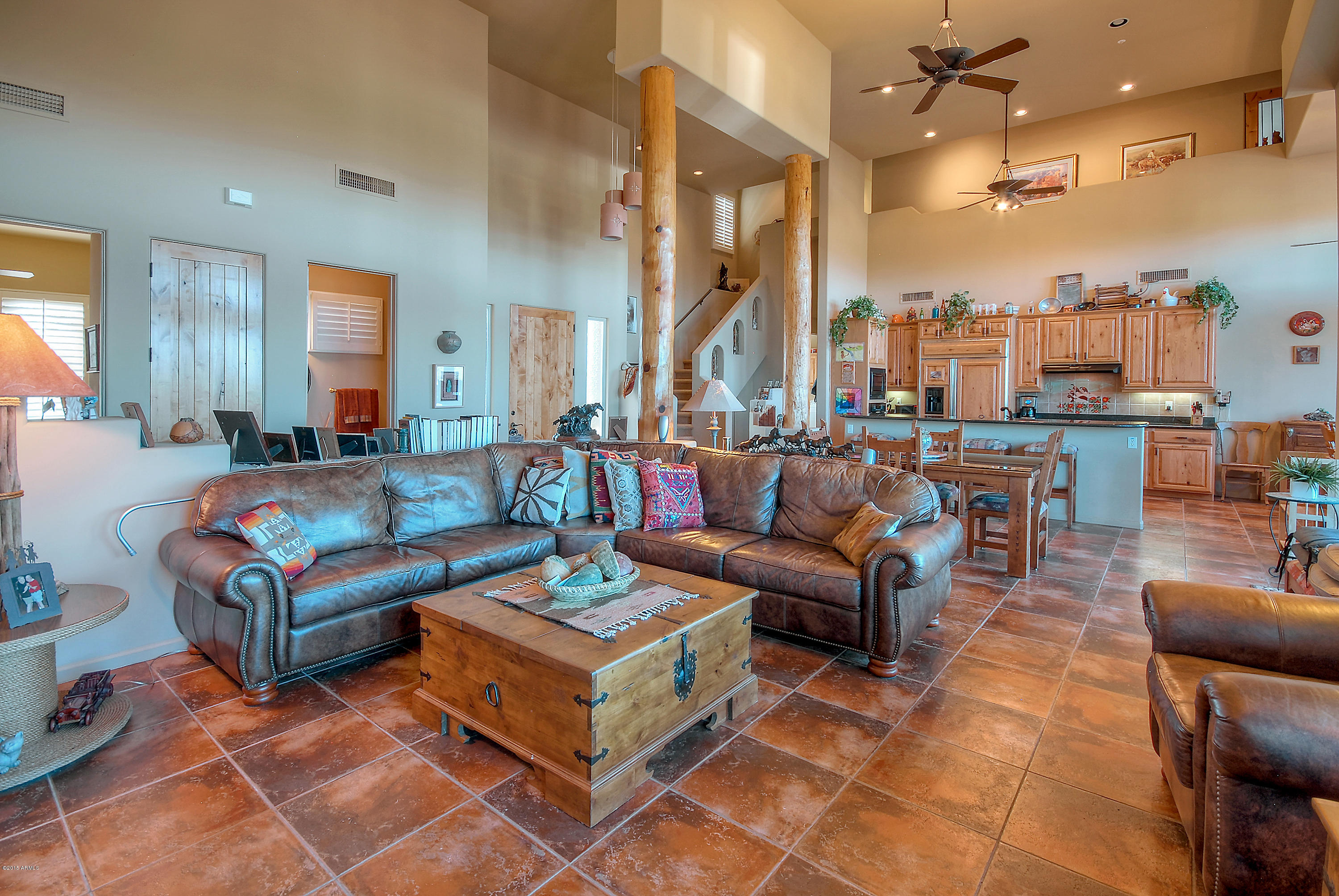 13502 East Jomax Road Scottsdale, AZ 85262 - Photo 6 of 50 a living room with furniture a large mirror and a view of living room