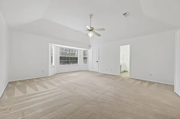 a view of an empty room with a window