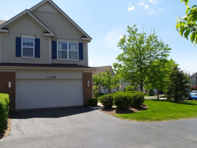 3129 Raphael Court St. Charles, IL 60175 - Photo 1 of 17 a front view of house with yard and green space